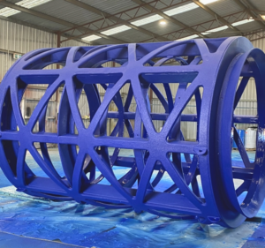 Polyurea used for trommel liners provides a tough, seamless coating on the steel