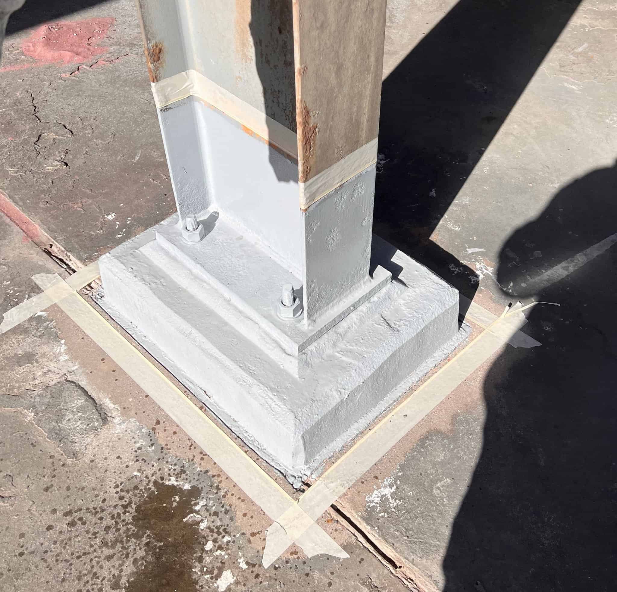 Concrete column base protected with polyurea